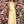 Clarisse 8155 is a long a-line prom dress with halter neckline, spaghetti strap back, pleated bodice, and lace trim belt.
